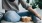 woman sits on a rug with a bowl of popcorn